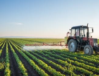 Tractor irrigating crops